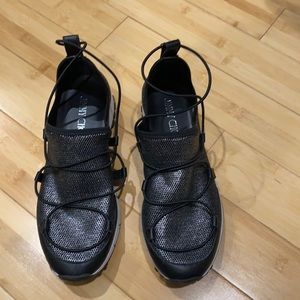 Jimmy Choo slip on shoes.